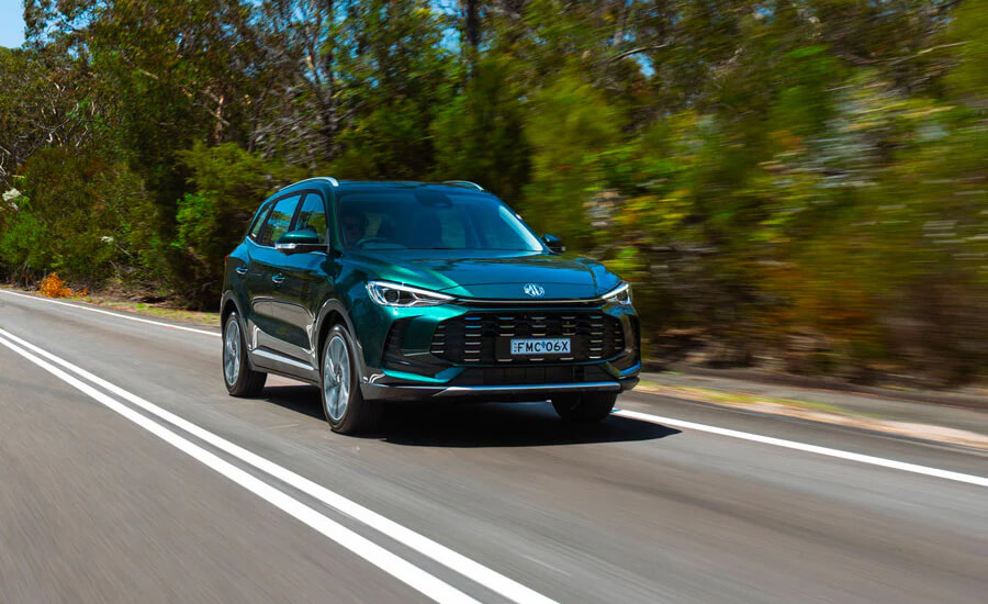 MG ZS HYBRID+ cruising down highway road