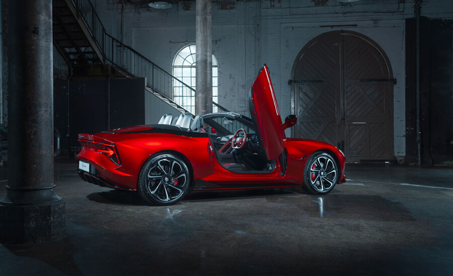 MG Cyberster rear 3/4 with drivers scissor door open