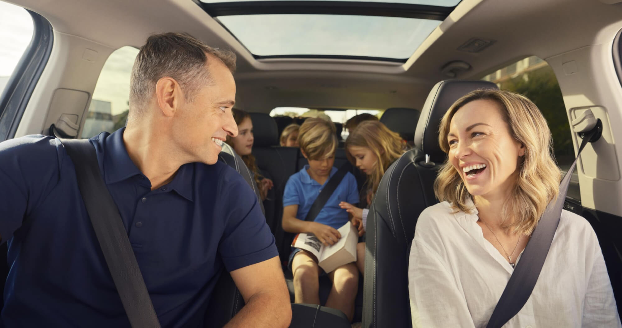 Family enjoying the spacious interior of the MG QS